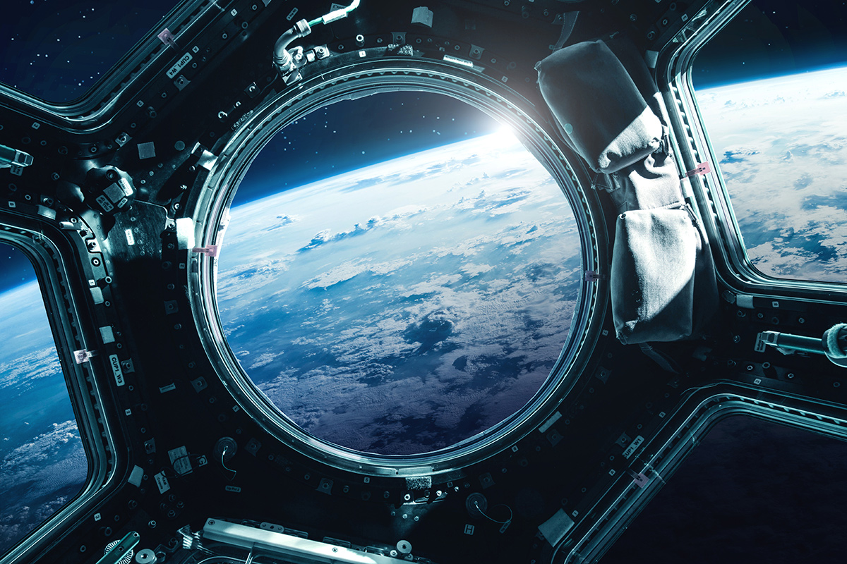 Porthole of space station with the Earth in the background
