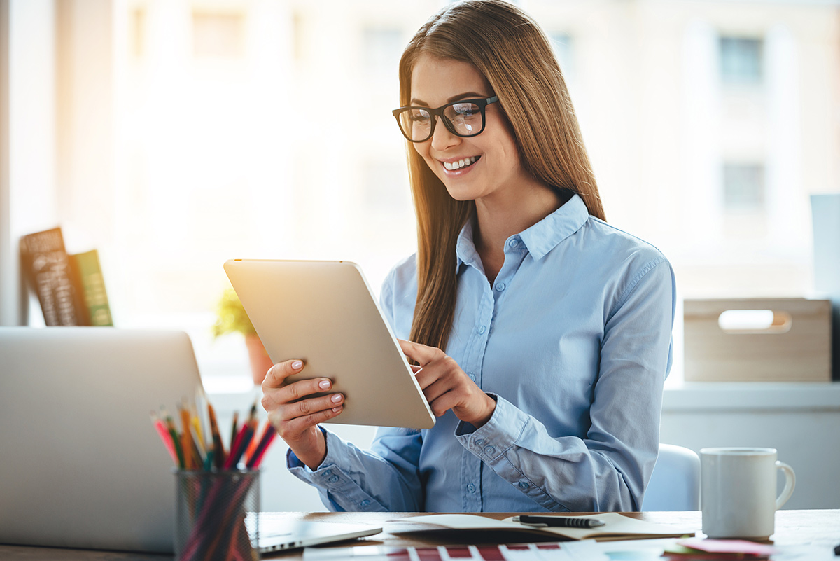 Female searching for jobs on a digital tablet