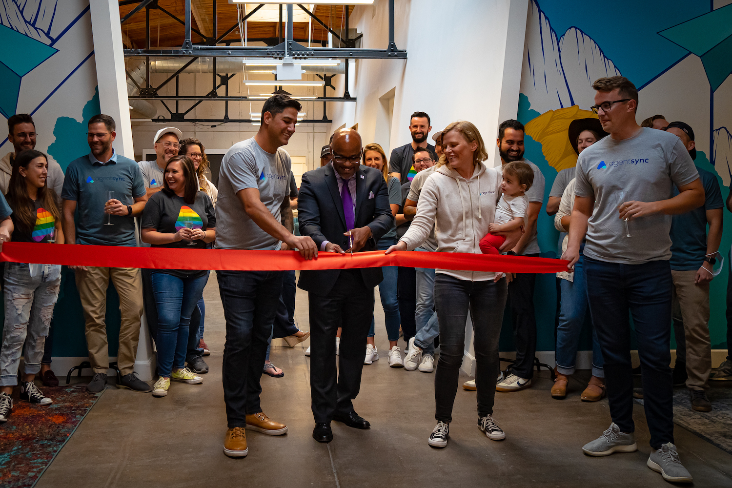 DENVER MAYOR MICHAEL HANCOCK ATTENDS A RIBBON-CUTTING CEREMONY AT AGENTSYNC'S NEW OFFICE.