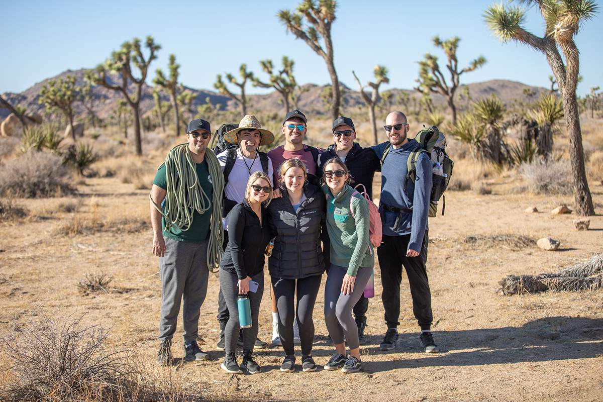 Demand IQ team members on a hike in the desert