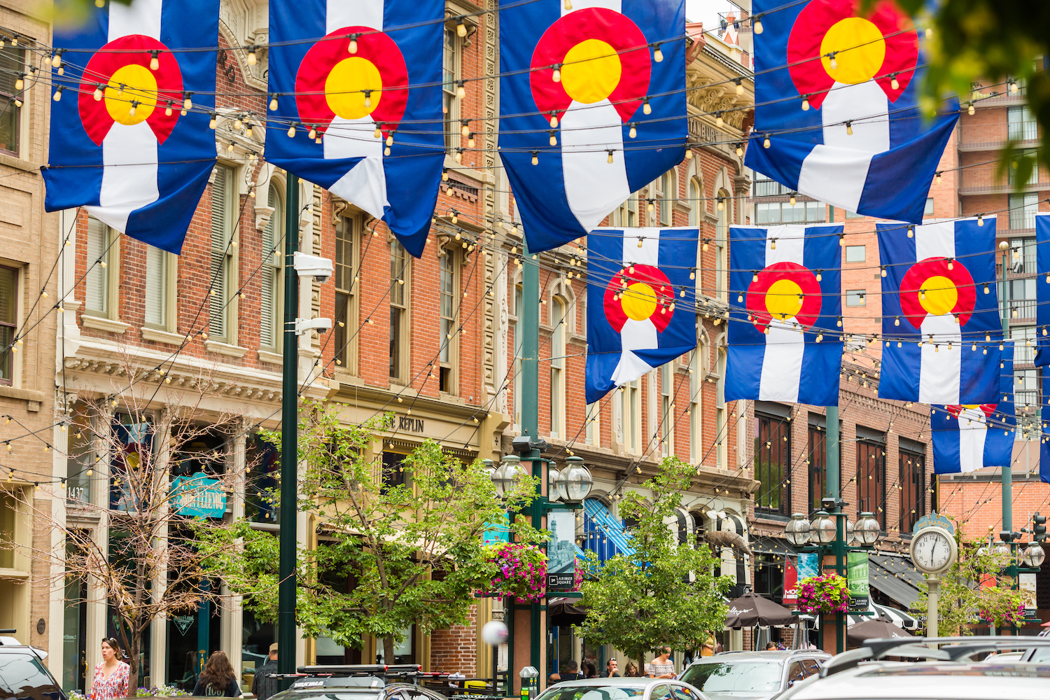 Colorado flags hang from Larimer Square storefronts in Denver.