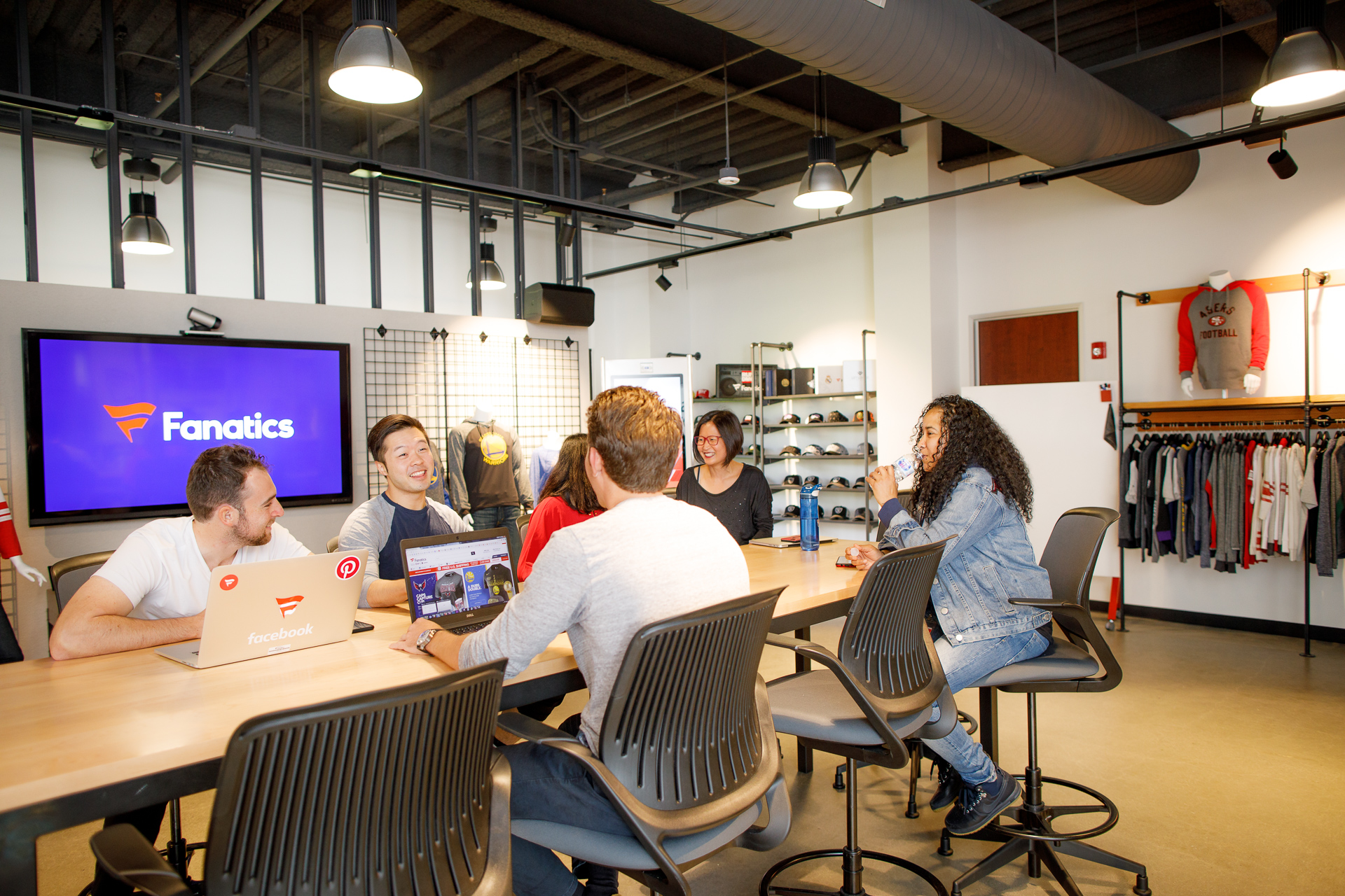 Fanatics employees in a meeting, pre-pandemic