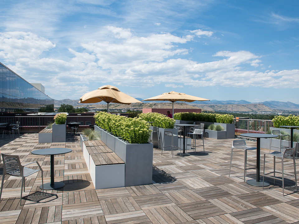 Rooftop seating area with mountains in background