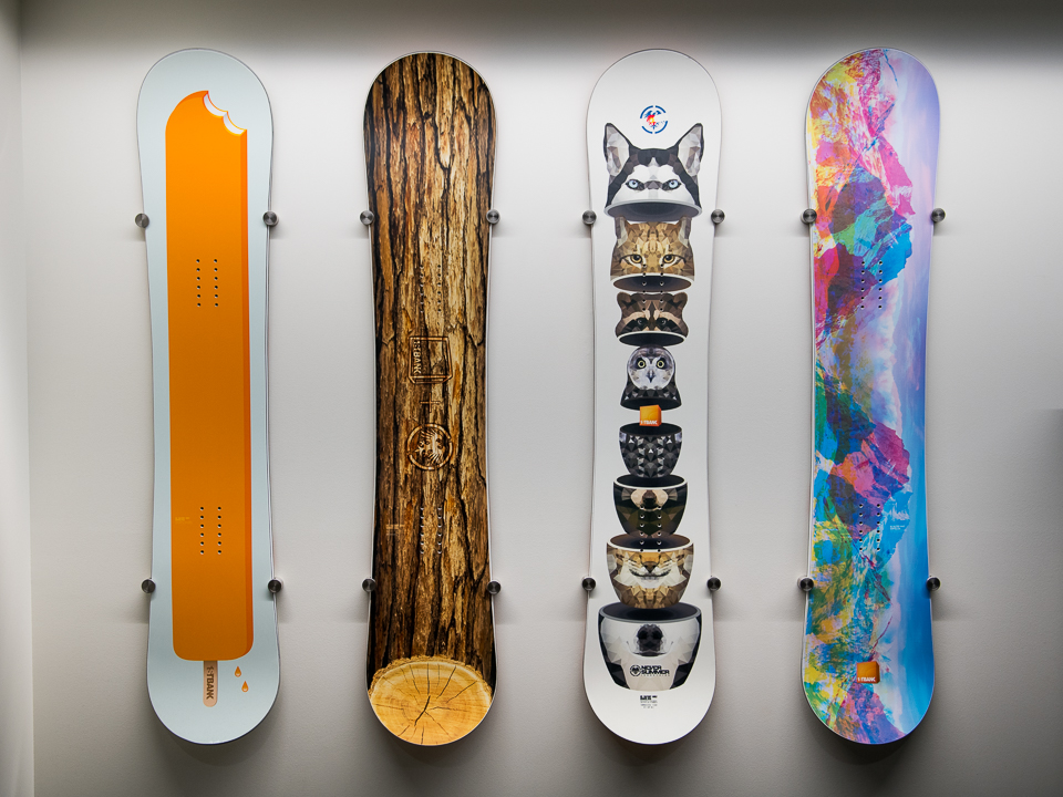 colorful snowboards hang on the wall of FirstBank