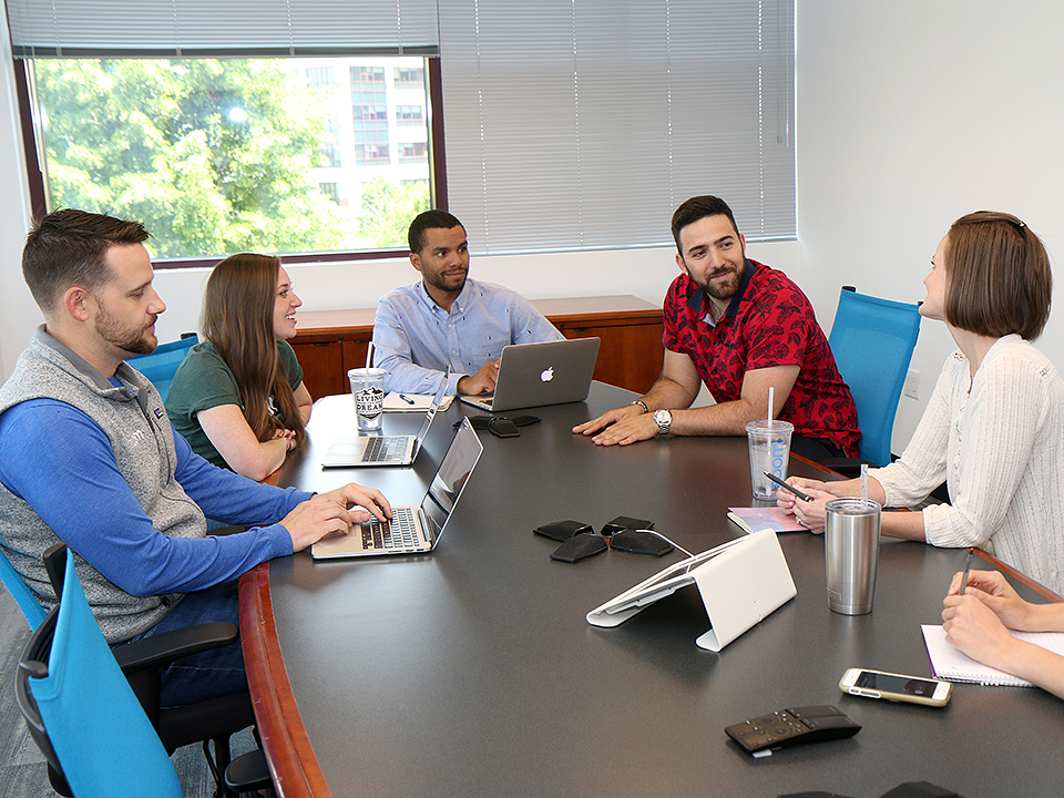 Zoom team collaborating in the office