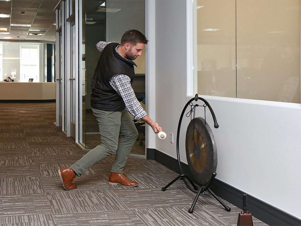 Carbon Black employee celebrates with a gong