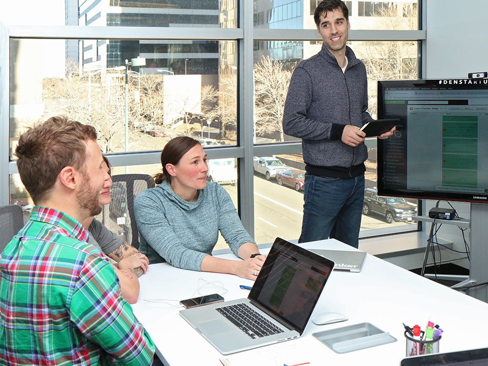 Employees hold a meeting at Blinker