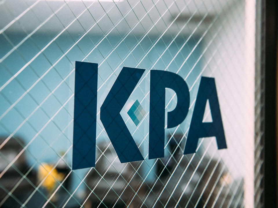 KPA logo on glass office door