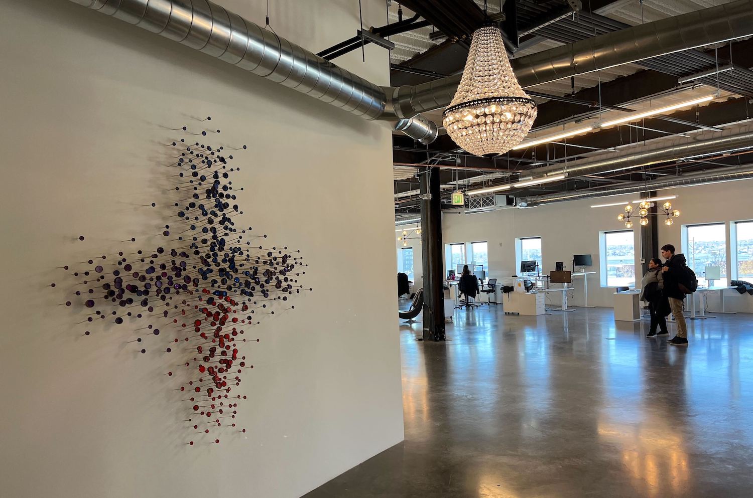 Kin + Carta’s logo adorns the wall of the company’s new Denver office. 