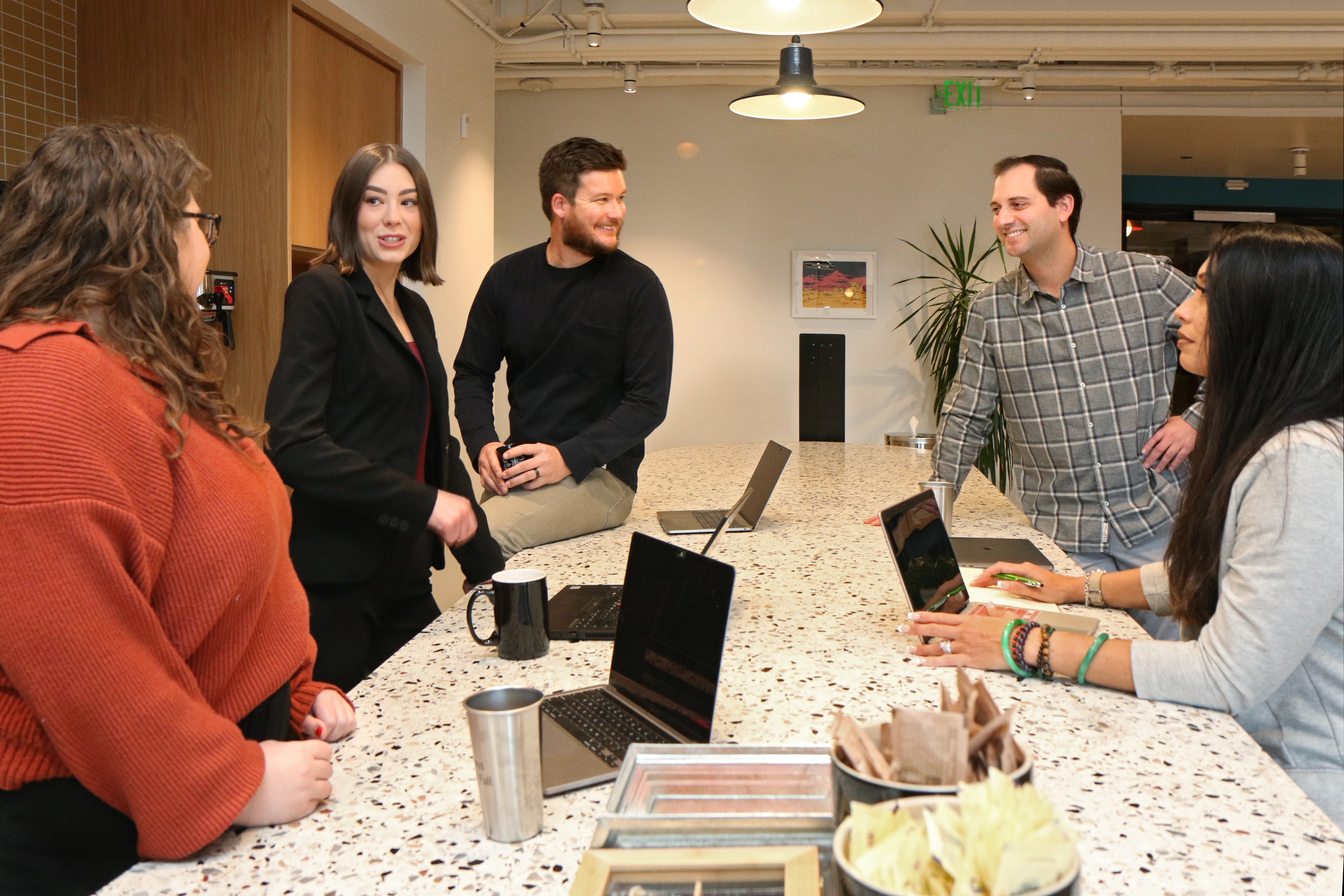 Matillion teammates chatting in company office kitchen