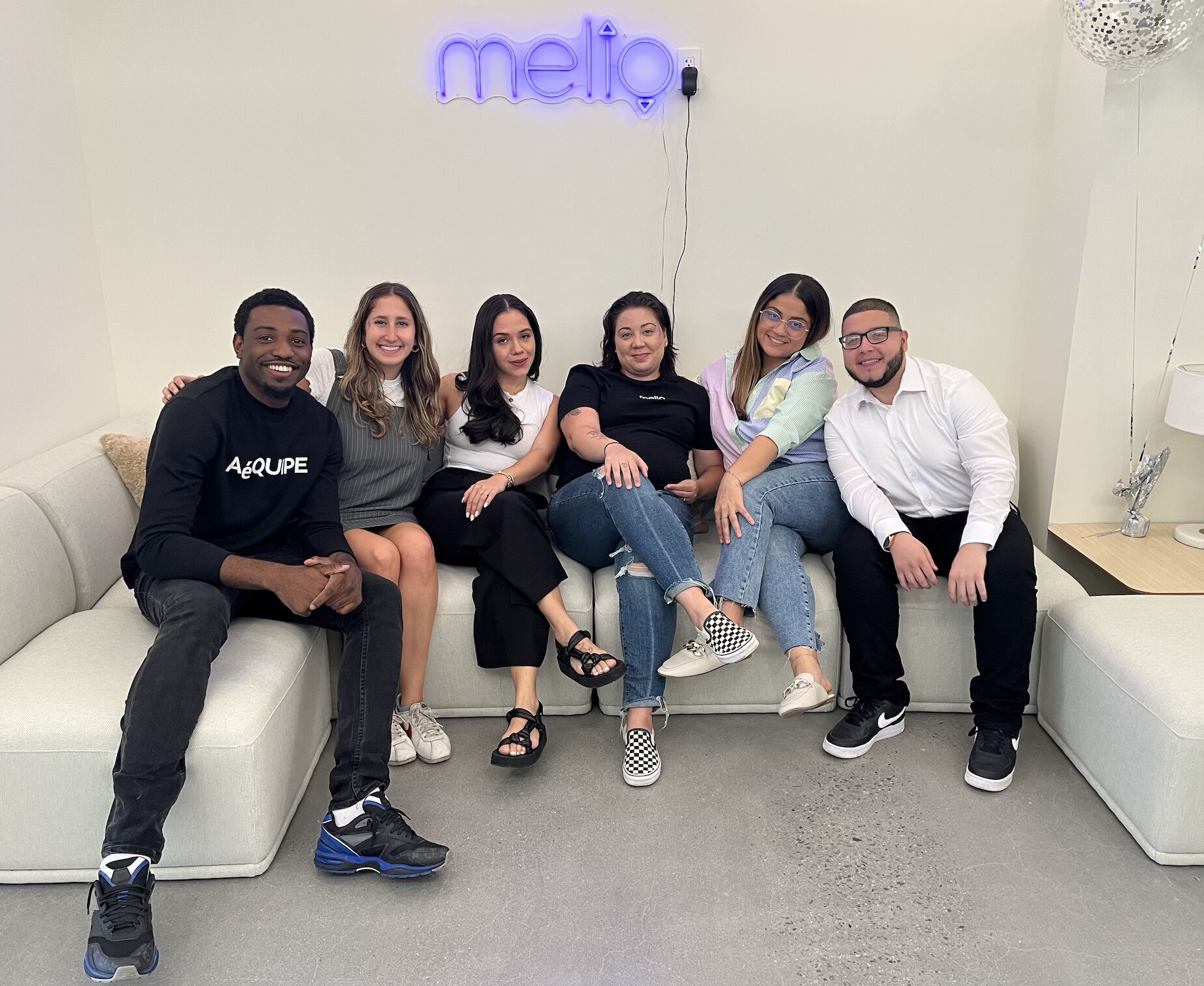 A group of Melio employees at the office.
