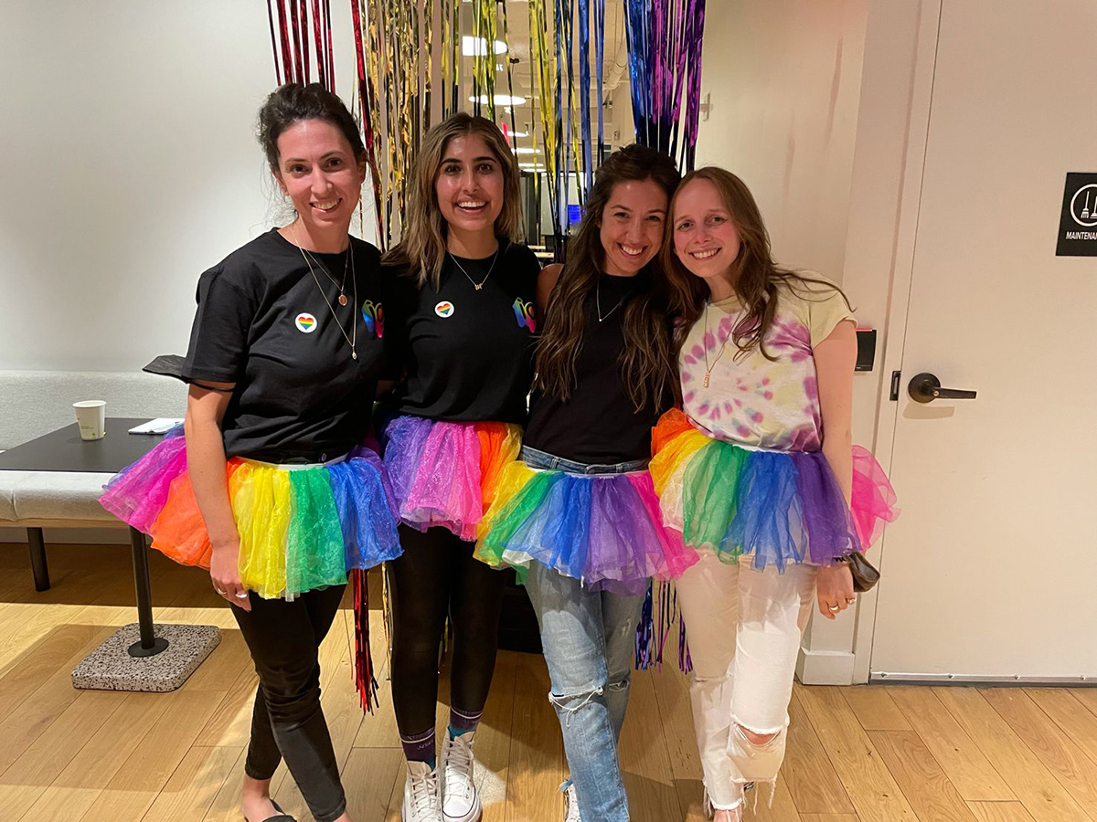 Melio team members wearing tutus with rainbow colors