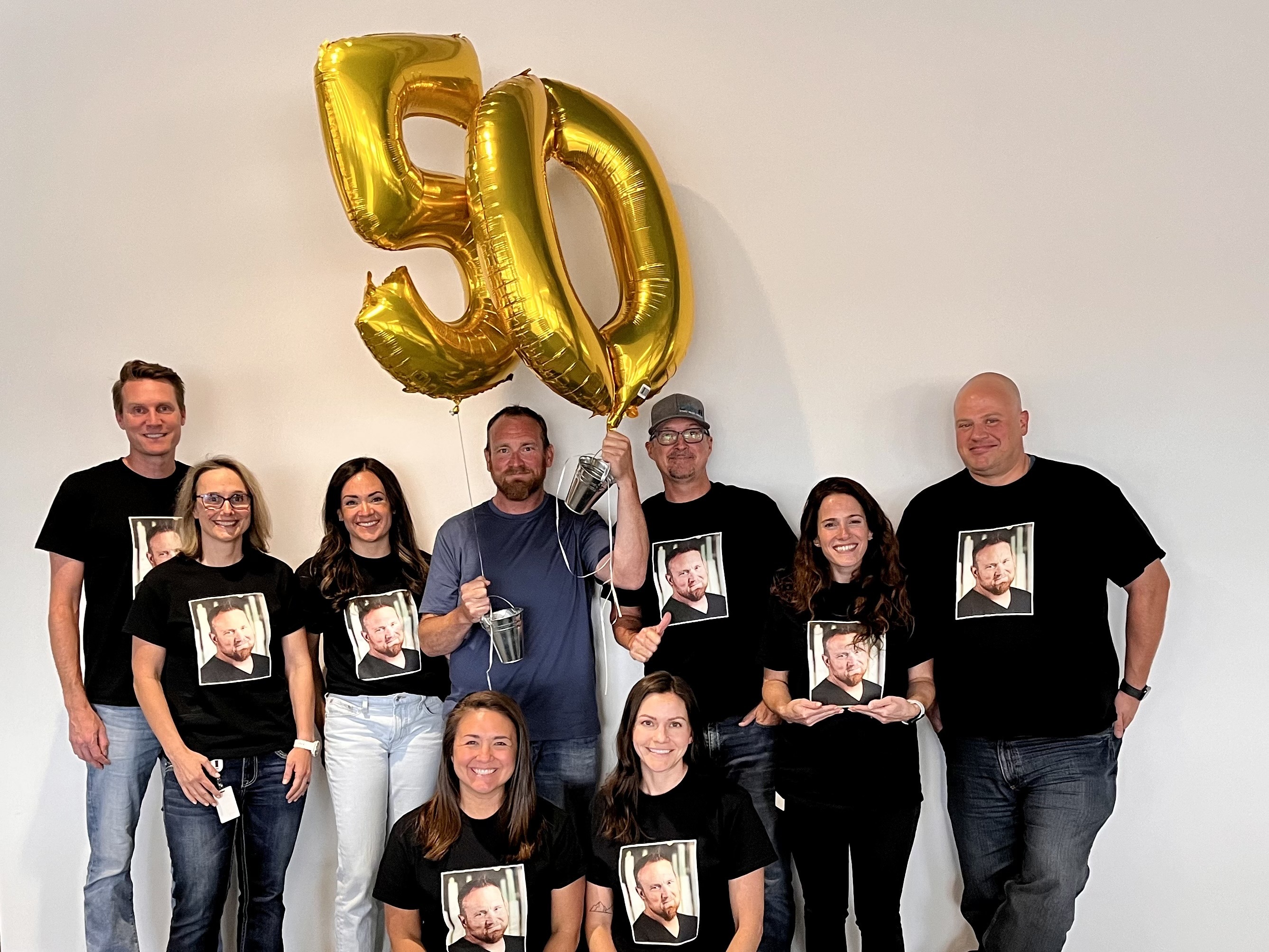 A group of OrthoFi employees celebrate a teammate's birthday.