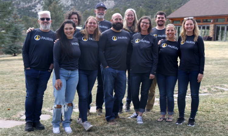 PAIRIN group photo outside with team members wearing matching company t-shirts