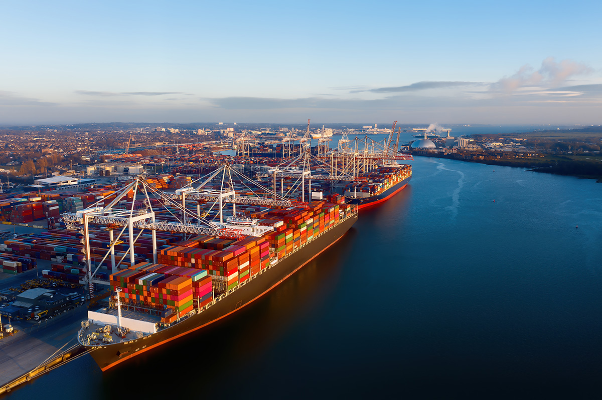 Aerial view of colorful containers on cargo ships at a port