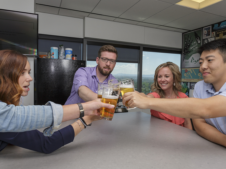 Pax8 staff enjoy beers in the office