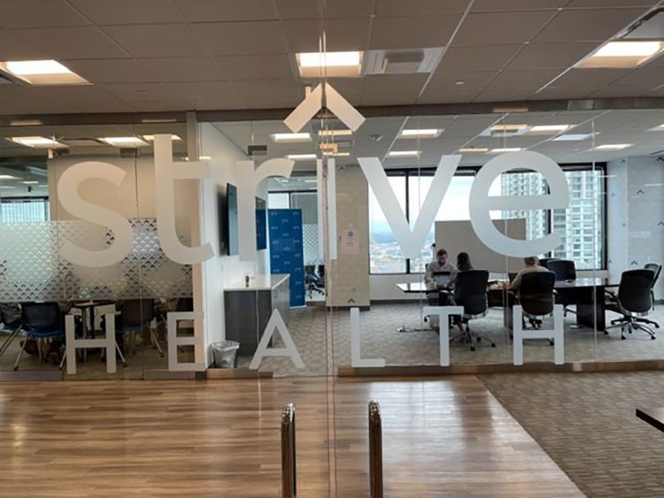 Strive Health logo on glass doors at the office