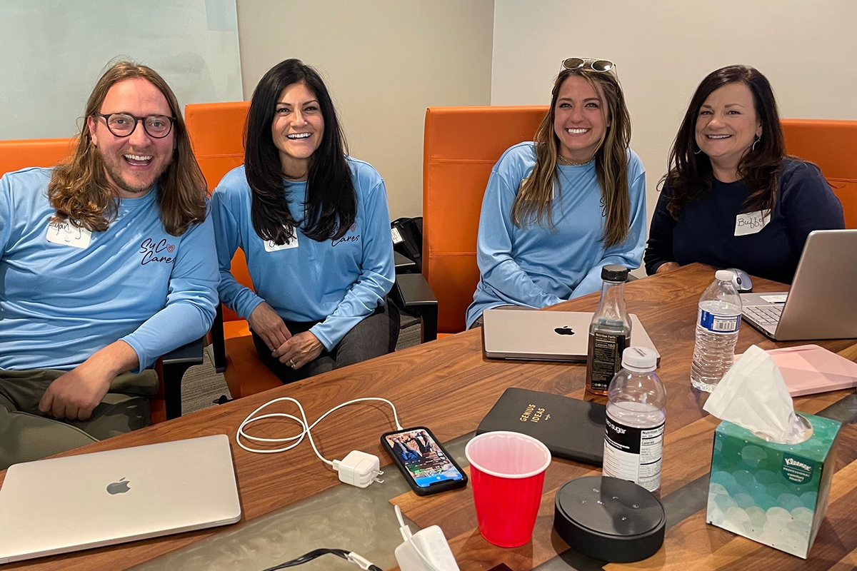 Suited Connector team members in the office