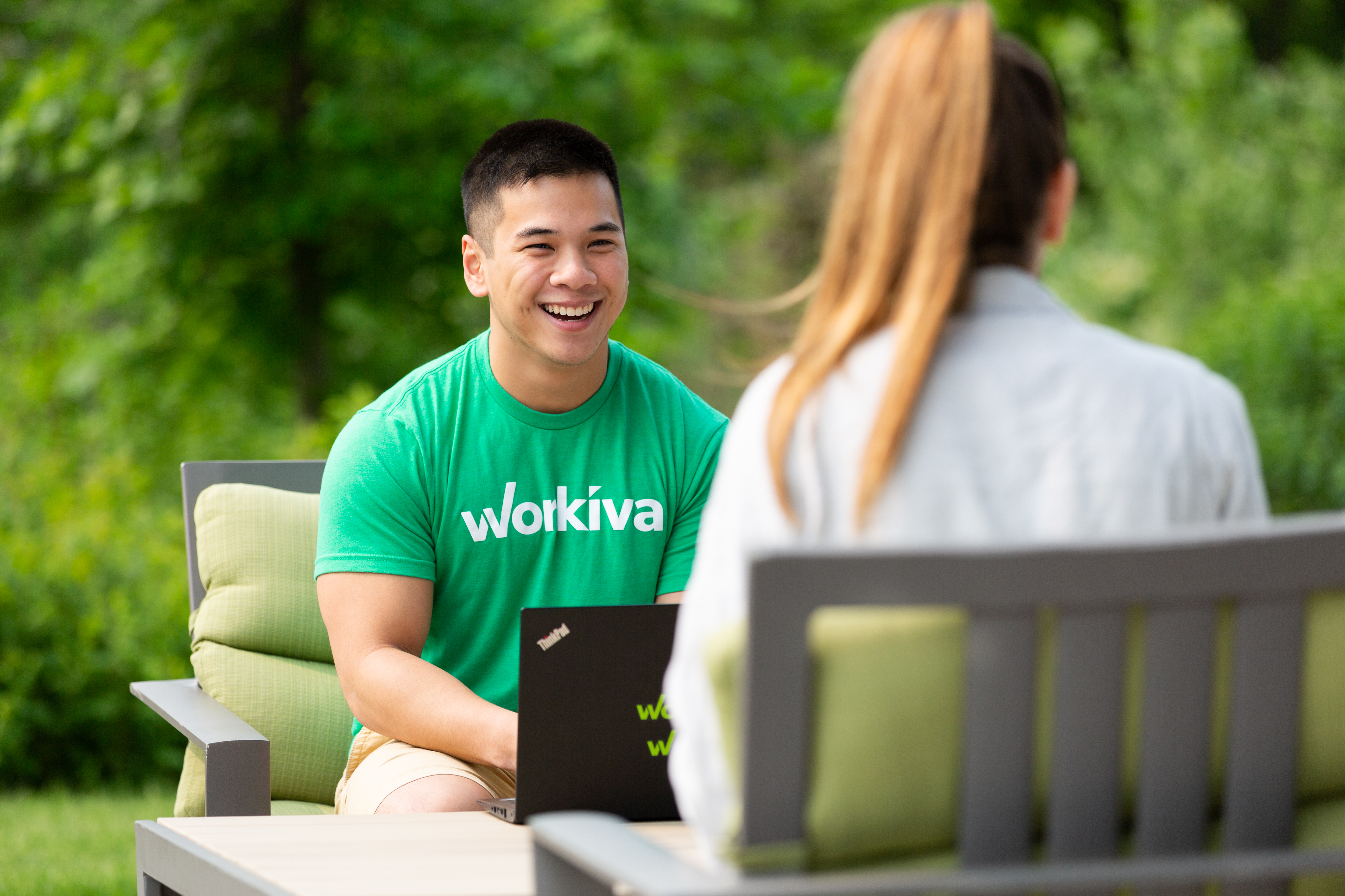 Workiva team members working together in an outdoor space