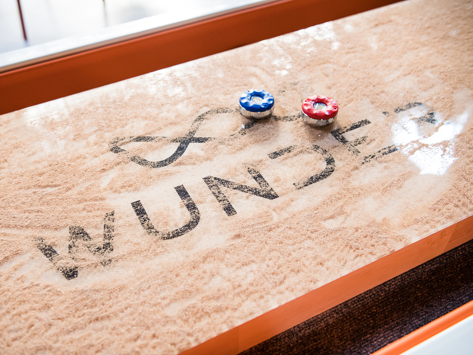 Close up of the Wunder logo on a shuffleboard table