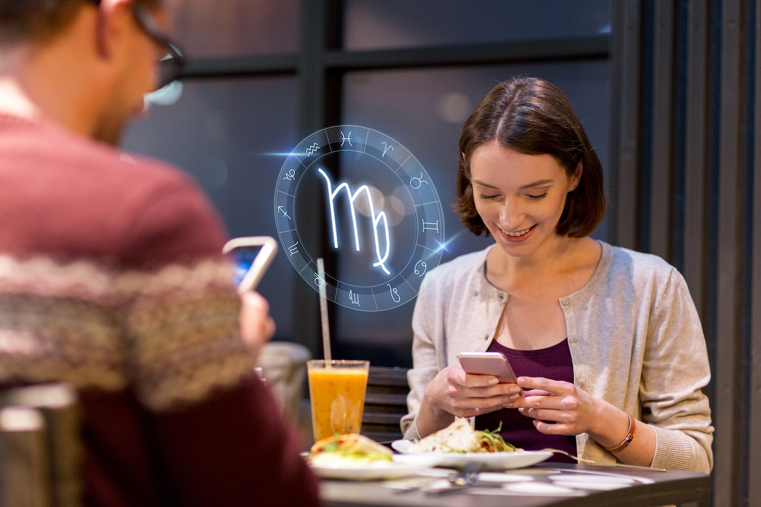 Online daters surrounded by astrology signs