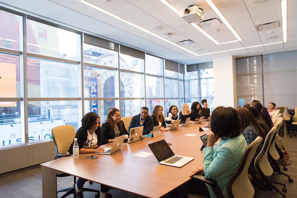 Group of Mentor Spaces coworkers in an office conference room