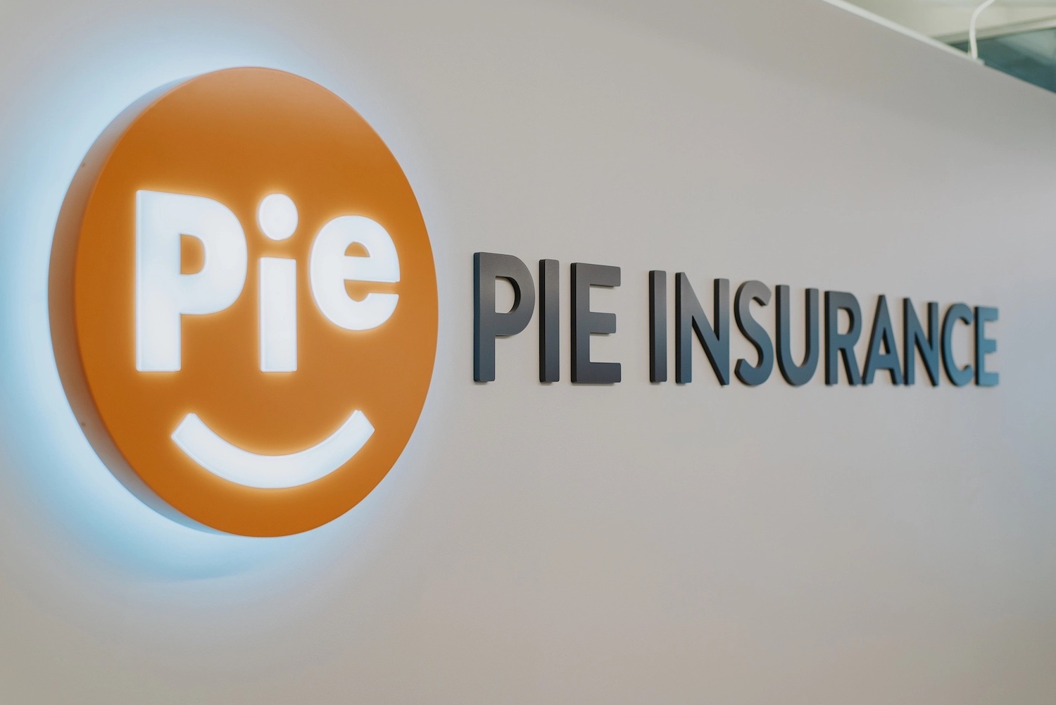 Pie Insurance logo on the wall of its Denver office.