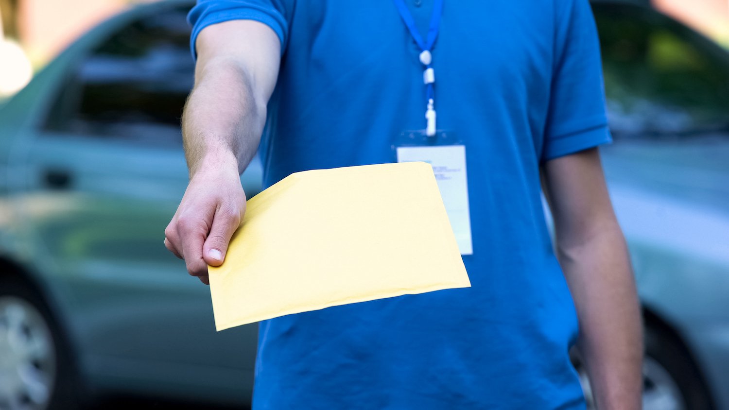 Stock photo of a document being delivered.