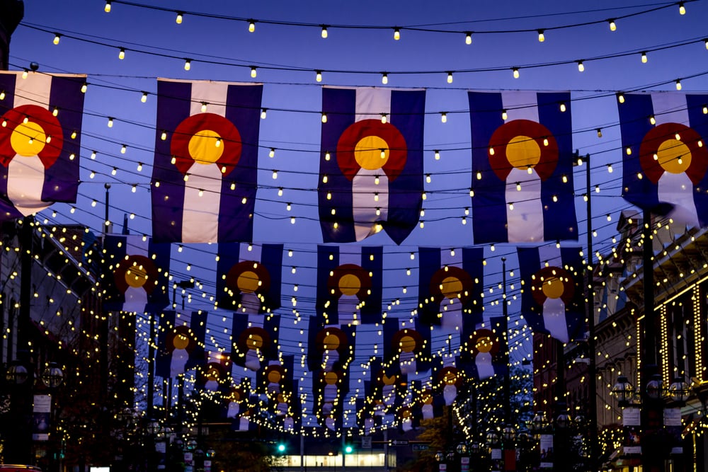 Colorado flags hanging over Larimer Square