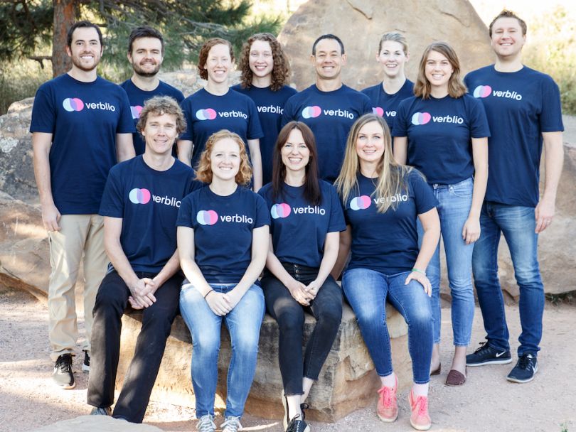 Verblio's team in company shirts, posing in front of a rock.