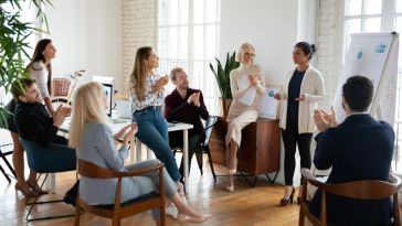 Female leader making a presentation to her colleagues