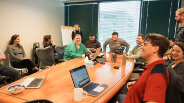 A group of Nymbl Science employees during a meeting.