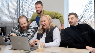 A group of KPA employees working on a project.